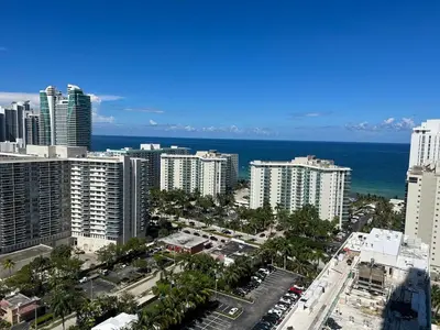an aerial view of a city with buildings and the ocean at Apt Hyde, Beach, Pool, and Resort Amenities in Miami in Hollywood