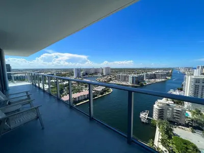 a balcony with a view of a river and buildings at Hyde the best apartment next to Hollywood Beach 2B 2B in Hollywood