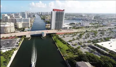 an aerial view of a city with a bridge over a river at Studio 2b 1b with Beach and Pool Miami Beach in Hallandale Beach