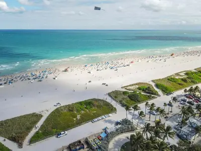 an aerial view of a beach with a lot of people at Amazing 1 Bedroom with Rooftop Pool D304 in Miami Beach