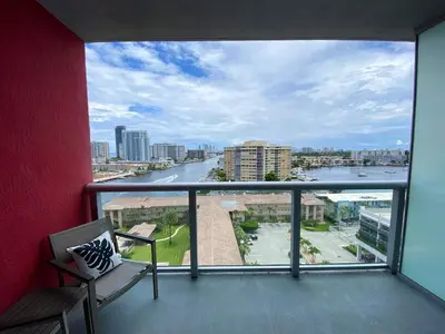 a balcony with a view of a river at Miami Apt with Amazing Views & Kitchen in Hallandale Beach