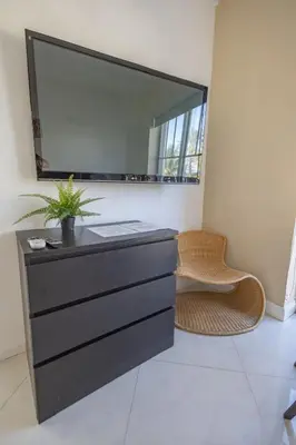 a bathroom with a black dresser and a mirror at Beautiful 1 bedroom with Rooftop Pool D209 in Miami Beach