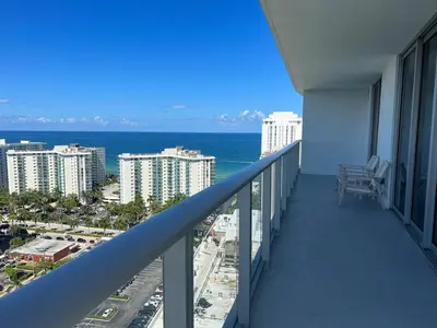 a balcony with a view of the ocean and buildings at Best Apartment next to Hollywood Beach 2B 2B in Hollywood