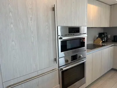 a kitchen with stainless steel ovens and cabinets at Best Apartment next to Hollywood Beach 2B 2B in Hollywood