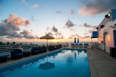 a swimming pool with a view of the ocean at Beautiful Studio with Rooftop pool B309 in Miami Beach