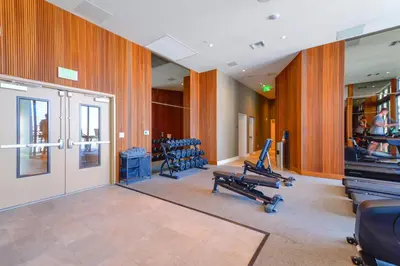 a gym with treadmills and exercise equipment in a building at Central Brickell Condo Walk to Shops & Dining in Miami