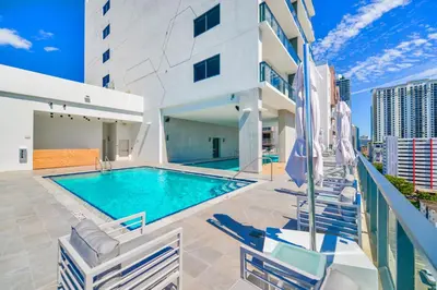 a swimming pool on the roof of a building at Central Brickell Condo Walk to Shops & Dining in Miami