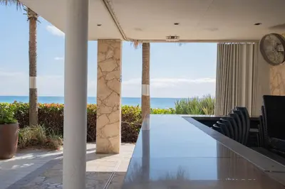a dining room with a view of the ocean at Studio Apmt 2 Beds with pool and gym in Hallandale Beach