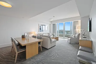 a living room with a couch and a table at Beachfront Ritz-Carlton Luxury 1BR Residence in Fort Lauderdale