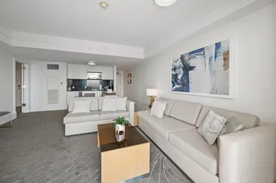 a living room with a couch and a table at Beachfront Ritz-Carlton Luxury 1BR Residence in Fort Lauderdale