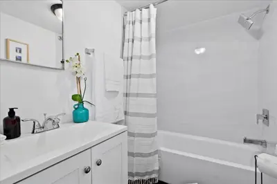 a bathroom with a sink and a shower curtain at 4BR Escape Near Beach & Downtown in Fort Lauderdale