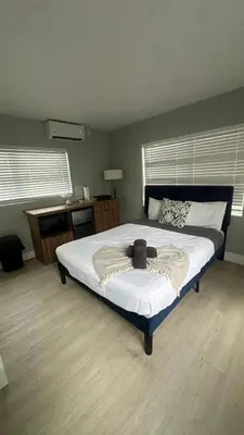 a bedroom with a large bed in a room at Charming 1BR Escape Near Hollywood & Dania in Dania Beach