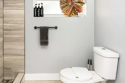 a bathroom with a white toilet in a room at Hollywood Beach 1BR | Steps to Dania Beach in Dania Beach