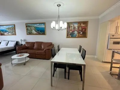 a living room with a couch and a table at Ocean Reserve Luxury Condo Sunny Isles Beach in Sunny Isles Beach