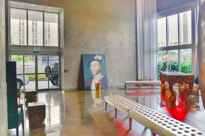 a room with a painting of a man on the wall at Luxury Miami Condo with Breathtaking City & Bay Views in Miami