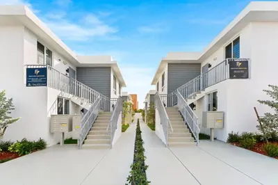 a walkway between two buildings with stairs at #206 Brand-New 2BR- 2BA Near Brickell in Miami