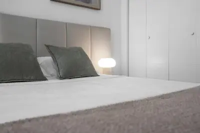a bed with two pillows and a lamp on it at #207 brand new 2BR 2BA near brickell and stadium Central location in Miami