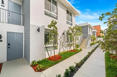 a house with a walkway in front of it at #207 brand new 2BR 2BA near brickell and stadium Central location in Miami