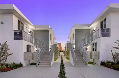 a row of apartment buildings with stairs between them at #207 brand new 2BR 2BA near brickell and stadium Central location in Miami