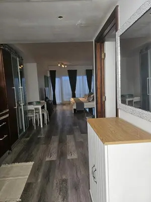 a living room with a couch and a table at Big studio with rooftop pool ocean view in Miami Beach