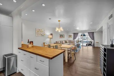 a kitchen and living room with a table and a dining room at Vista Mar Scenic 3BR Family Waterfront w Private Dock in North Miami