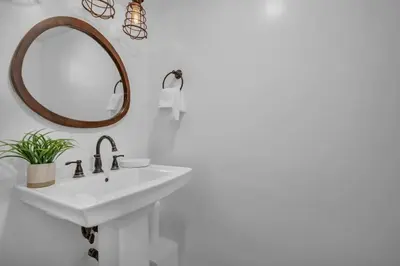 a bathroom with a sink and a mirror at Vista Mar Scenic 3BR Family Waterfront w Private Dock in North Miami