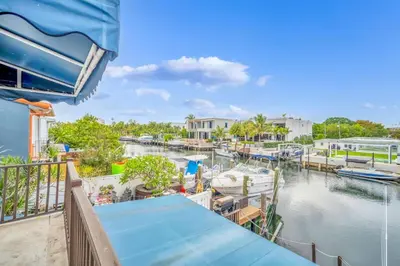 a view from the balcony of a marina at Vista Mar Scenic 3BR Family Waterfront w Private Dock in North Miami