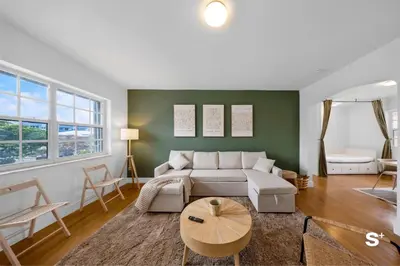 a living room with a couch and a table at Spacious 1BD Beachside Apt with Free Parking in Miami Beach
