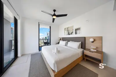 a bedroom with a large bed and a large window at 2-BD Downtown Miami Condo with City Views in Miami