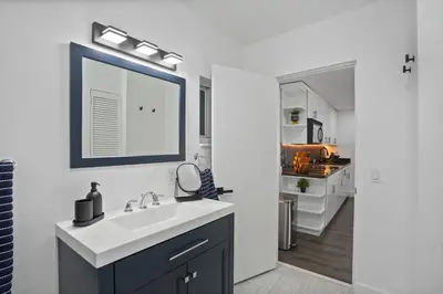 a bathroom with a sink and a mirror at Luxury 1 bedroom apt in Kendall Prime Location in Westwood Lake