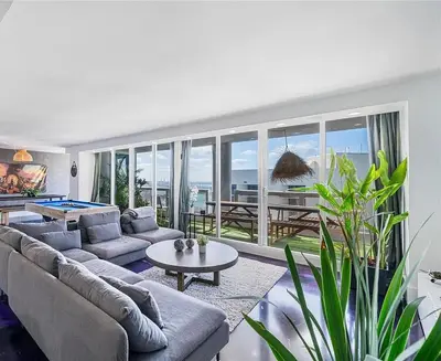 a living room with couches and a pool table at Luxury 3-Bedroom Bayview Retreat at The Grand Miami in Miami