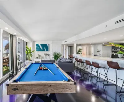 a living room with a pool table and a bar at Luxury 3-Bedroom Bayview Retreat at The Grand Miami in Miami