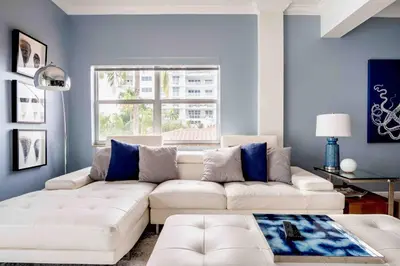 a living room with a white couch and a window at The Blue Octopus - 1br King Bed Condo in Fort Lauderdale