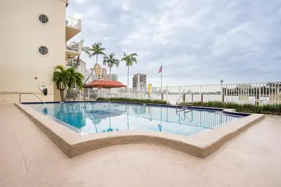 a swimming pool in the middle of a building at The Blue Octopus - 1br King Bed Condo in Fort Lauderdale