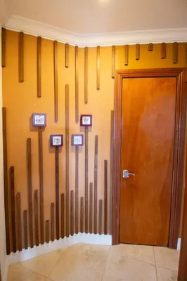 a room with a door and arrows on the wall at Sunset in Sunset