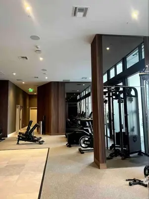 a gym with treadmills and machines in a building at Modern Brickell Luxe Apartment by Palermo Home Miami in Miami