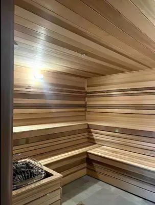 a sauna with wooden paneled walls and a wooden floor at Modern Brickell Luxe Apartment by Palermo Home Miami in Miami
