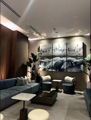 a living room with a blue couch and some tables at Modern Brickell Luxe Apartment by Palermo Home Miami in Miami
