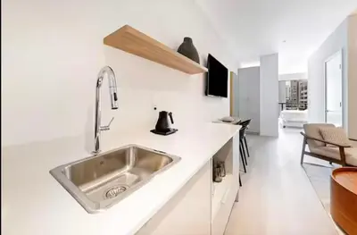 a kitchen with a sink in a white kitchen at Modern Brickell Luxe Apartment by Palermo Home Miami in Miami