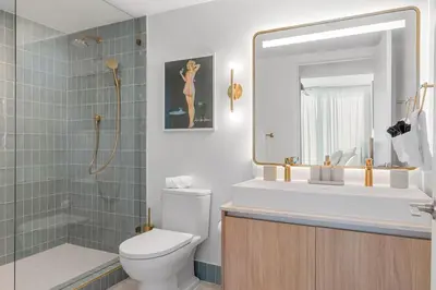 a bathroom with a toilet and a shower and a sink at 3701 Kaseya Center 2 Bdr Apt with Pool and Gym in Miami