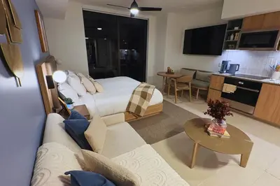 a bedroom with a bed and a living room at 3610 Calm Blue Studio w Balcony View Pool and Gym in Miami