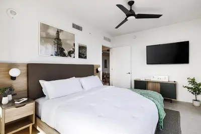 a bedroom with a bed and a ceiling fan at 4305 High Floor Apt with City and Marina Views in Miami