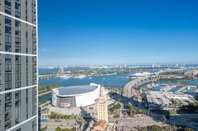 an aerial view of a city with a clock tower at 3012 Studio in front of Kaseya Center with Pool in Miami