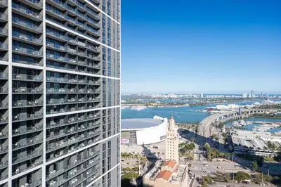 an aerial view of a tall building and a river at 3012 Studio in front of Kaseya Center with Pool in Miami