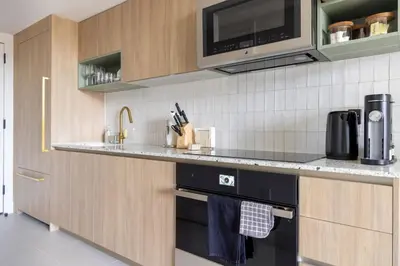 a kitchen with a sink and a microwave at 2414 Chic Stay in Miami Downtown with Bay and City Views a Pool and Gym in Miami