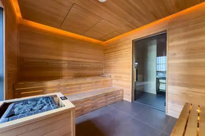 a sauna with a bench and a wooden wall at 2414 Chic Stay in Miami Downtown with Bay and City Views a Pool and Gym in Miami
