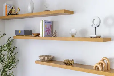 a set of wooden shelves on a white wall at 3615 Luxury Condo for 8 people with Gym and Pool in front of Kaseya Center in Miami