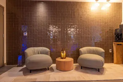 a waiting room with two chairs and a table at 3001 Miami Downtown Apt with Gym and Pool next to Kaseya Center in Miami