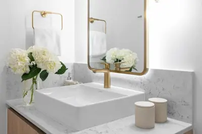 a bathroom with a white sink and a mirror at 3002 Downtown Miami apt in front of Kaseya Center with Gym and Pool in Miami