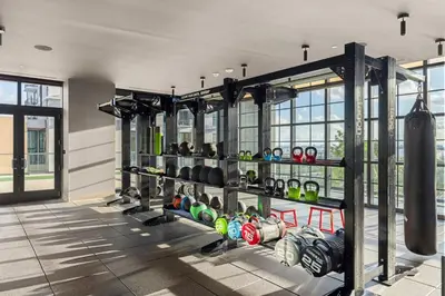 a gym with a bunch of dumbbells on display at 3808 Apt Next to Kaseya Center with Pool a Spa and Gym in Miami